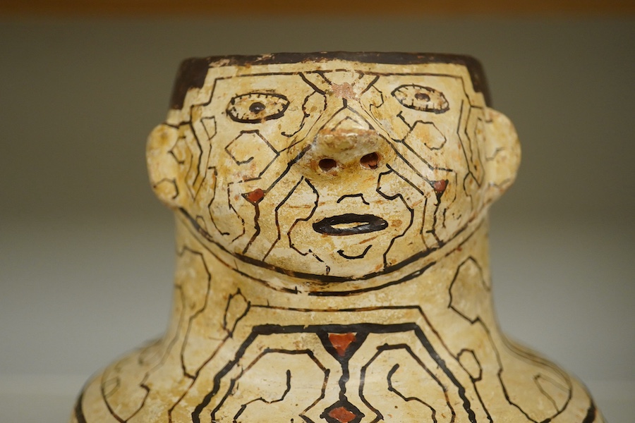 A 20th century Shipibo terracotta geometric decorated figural vase. Condition - minor paint chips